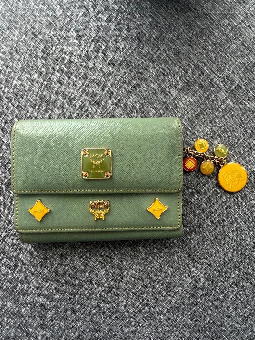 MCM Green Leather Compact Wallet with Gold Accents and Charm